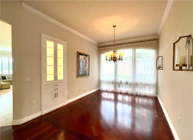 860 Saint James Ln, Vero Beach, FL 32967 - unfurnished dining area with dark wood-style flooring, crown molding, baseboards, and a chandelier