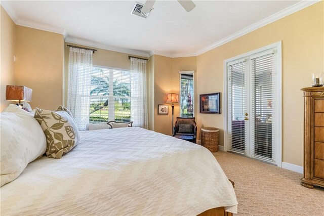 carpeted bedroom featuring ornamental molding and ceiling fan