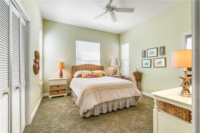 bedroom with a closet, light carpet, and multiple windows