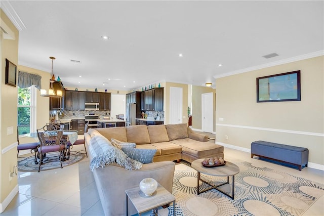 living room with light tile patterned flooring and ornamental molding