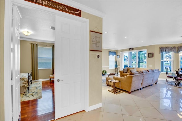 tiled living room with crown molding