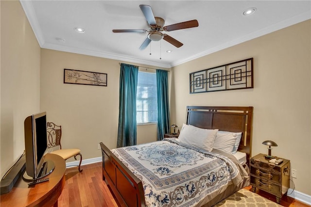 bedroom with ceiling fan, light hardwood / wood-style floors, and crown molding