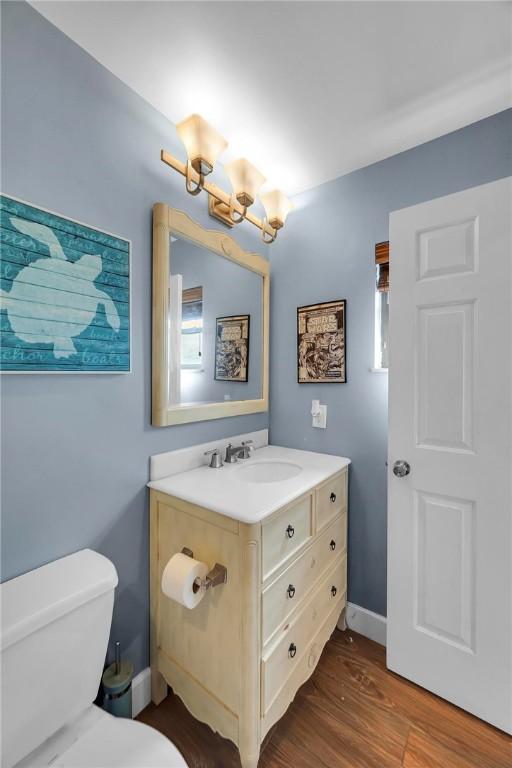 1966 9th St, Vero Beach, FL 32960 - half bath featuring vanity and wood finished floors