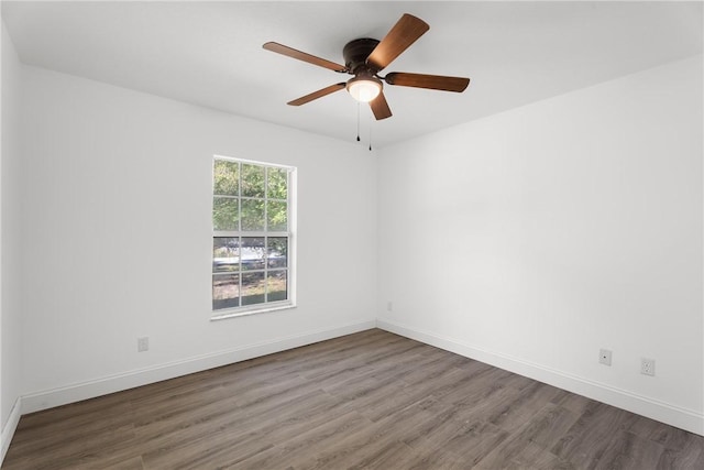 empty room with ceiling fan and wood-type flooring