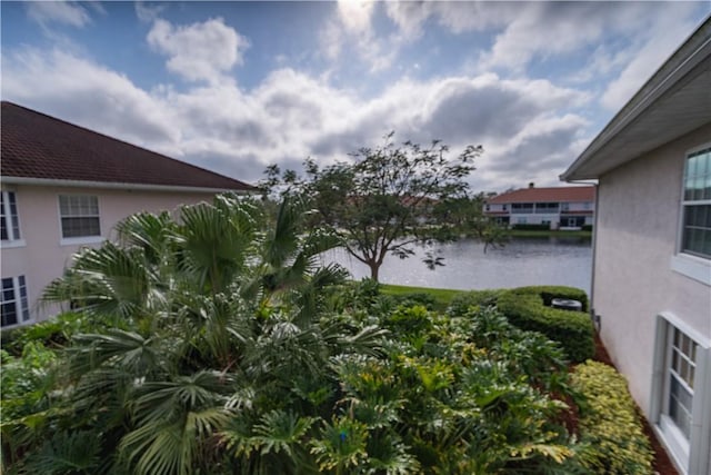 exterior space with a water view