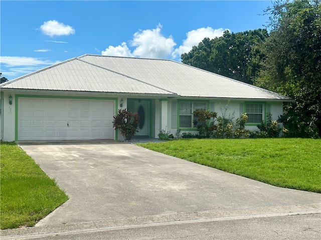 ranch-style home featuring a garage and a front yard