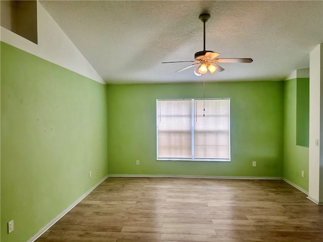 unfurnished room with a textured ceiling, ceiling fan, and light hardwood / wood-style flooring