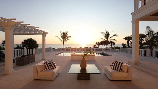 exterior space featuring a water view, a pergola, and an outdoor hangout area