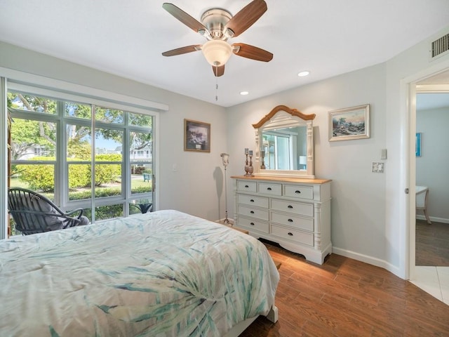 2800 Indian River Blvd Unit J1, Vero Beach, FL 32960 - bedroom featuring baseboards, wood finished floors, recessed lighting, ceiling fan, and access to outside