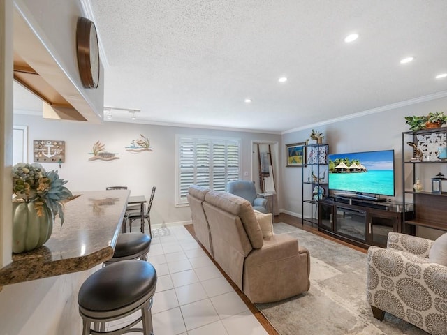 2800 Indian River Blvd Unit J1, Vero Beach, FL 32960 - living room with ornamental molding, baseboards, recessed lighting, and light tile patterned flooring