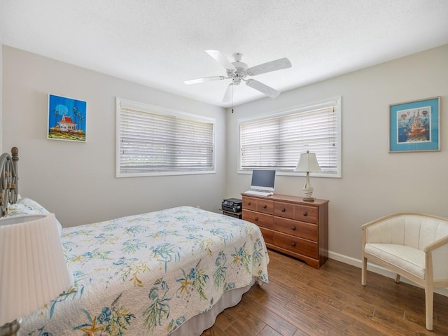 2800 Indian River Blvd Unit J1, Vero Beach, FL 32960 - bedroom with wood finished floors, baseboards, and a ceiling fan