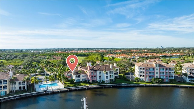 birds eye view of property featuring a water view and a residential view