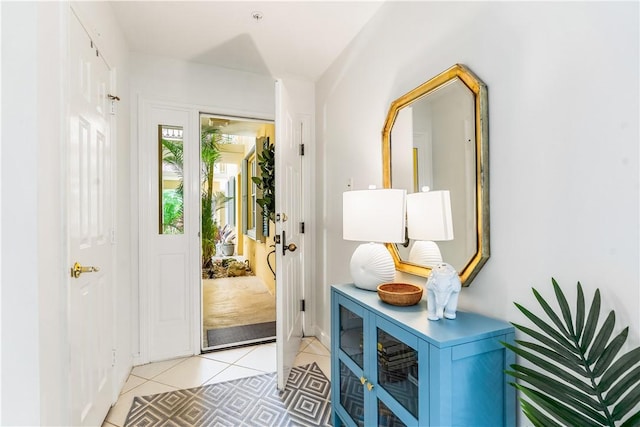 doorway featuring light tile patterned flooring