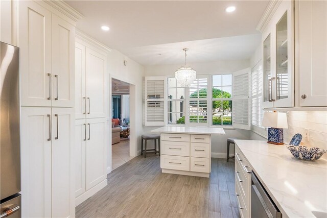 kitchen with stainless steel appliances, backsplash, light wood-style floors, glass insert cabinets, and white cabinetry