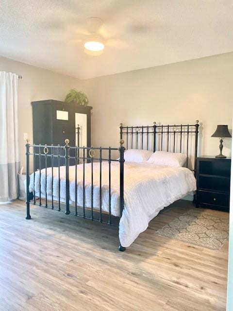 bedroom featuring wood finished floors