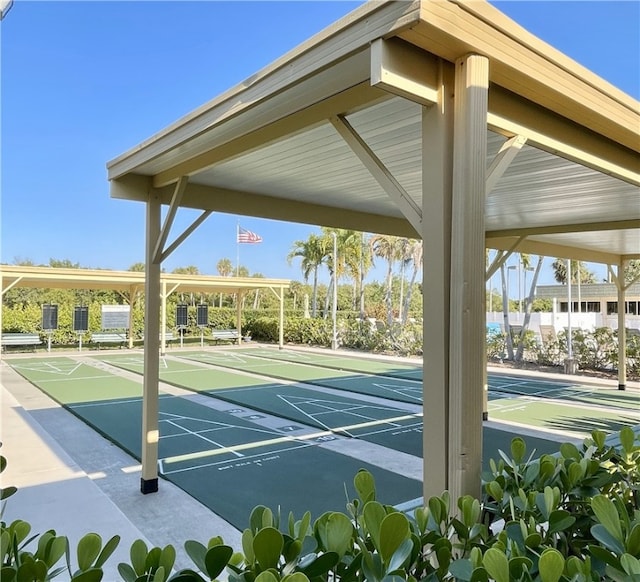 view of property's community featuring shuffleboard