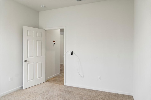 2025 Amazon Way SW, Vero Beach, FL 32962 - spare room with light carpet, a smoke detector, and baseboards