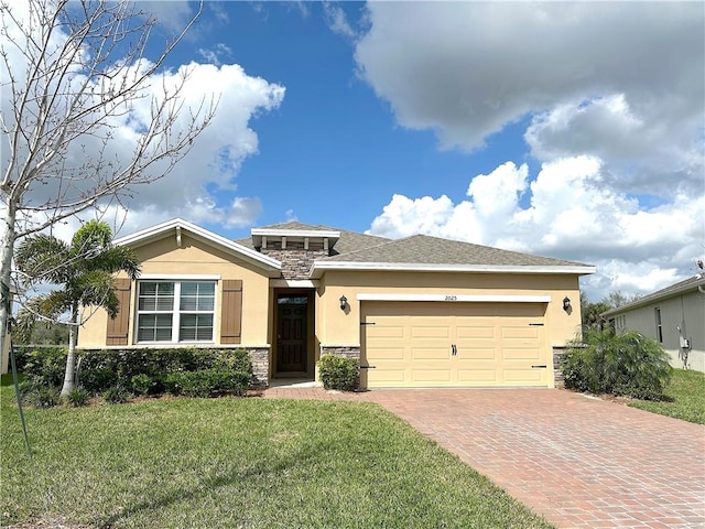 view of front of property featuring a garage and a front lawn