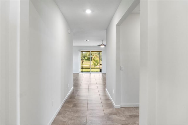 2025 Amazon Way SW, Vero Beach, FL 32962 - corridor featuring baseboards and light tile patterned flooring