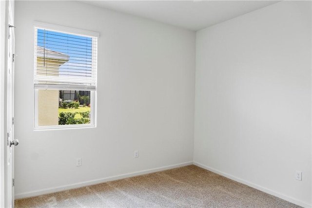 2025 Amazon Way SW, Vero Beach, FL 32962 - empty room featuring light carpet and baseboards