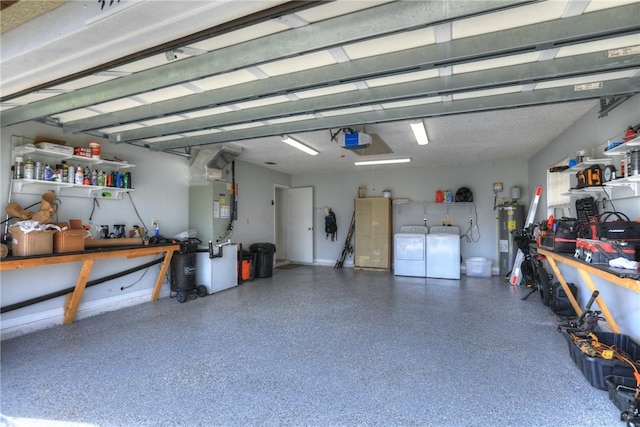 garage with electric water heater, heating unit, washer and clothes dryer, a workshop area, and a garage door opener