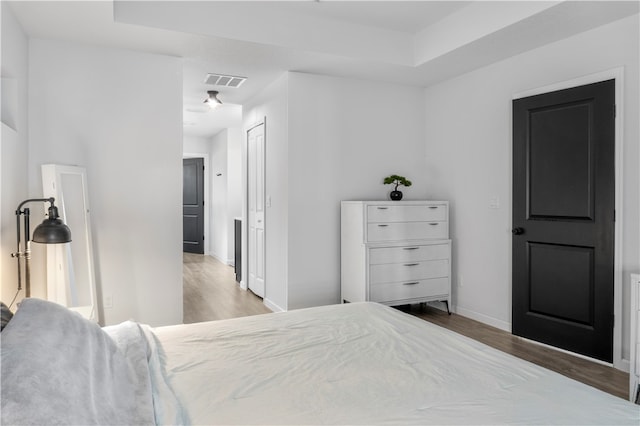 bedroom featuring a closet and light hardwood / wood-style flooring