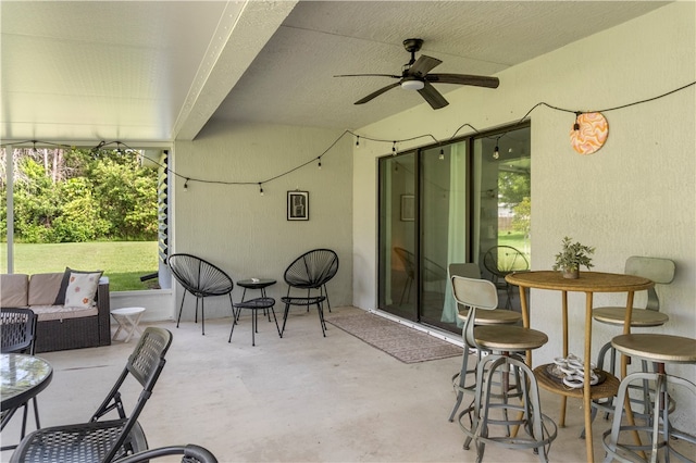 view of patio featuring outdoor lounge area and ceiling fan