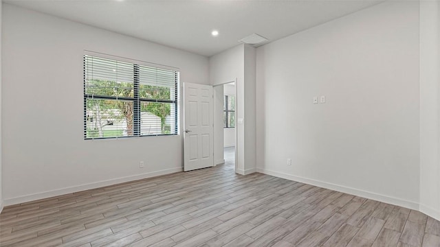 unfurnished room featuring light hardwood / wood-style flooring