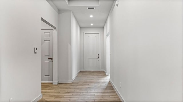 hallway with light wood-type flooring