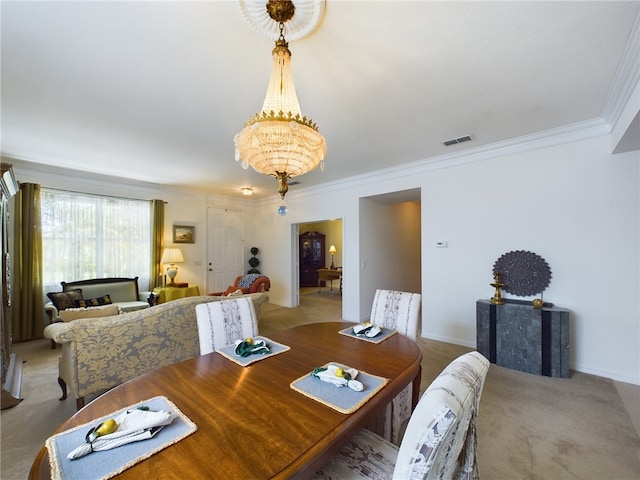 dining area featuring carpet flooring, ornamental molding, and a notable chandelier