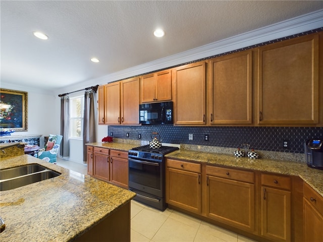 kitchen with light tile patterned flooring, black appliances, a textured ceiling, backsplash, and crown molding