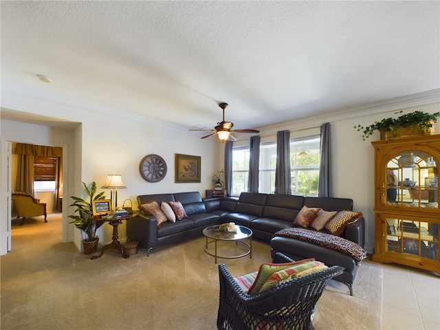 living room featuring crown molding, light carpet, a textured ceiling, and ceiling fan