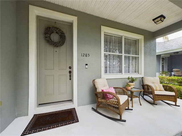 entrance to property with a porch