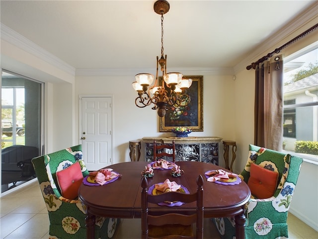 tiled dining room with a chandelier and crown molding