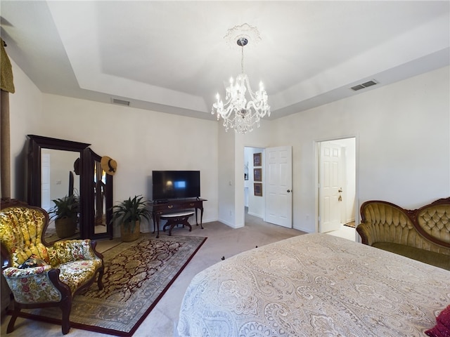 carpeted bedroom with an inviting chandelier