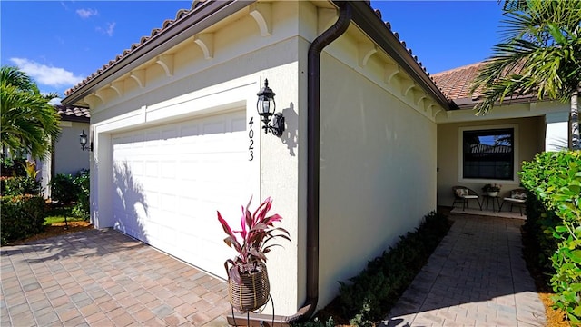 view of property exterior featuring a garage