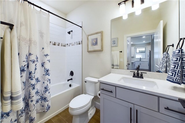 full bathroom with tile patterned flooring, shower / tub combo with curtain, vanity, and toilet