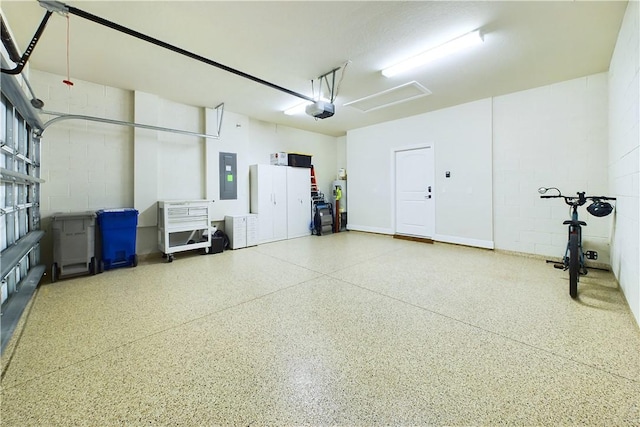 garage with electric panel, electric water heater, and a garage door opener