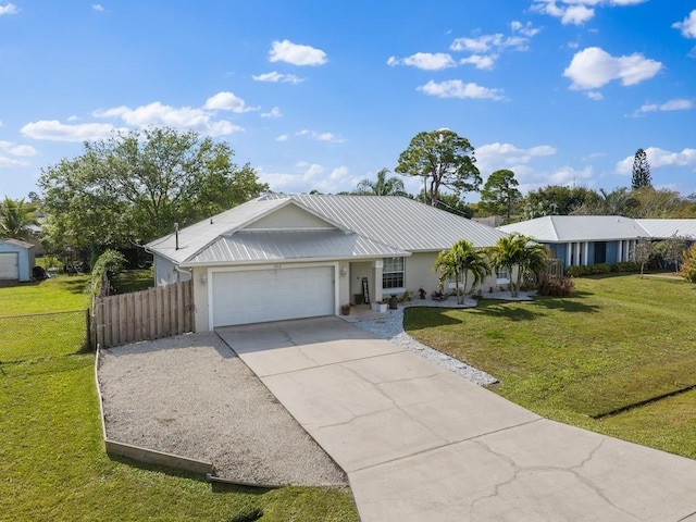 ranch-style home with a garage and a front lawn