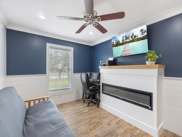 office area featuring ornamental molding, ceiling fan, and light hardwood / wood-style floors