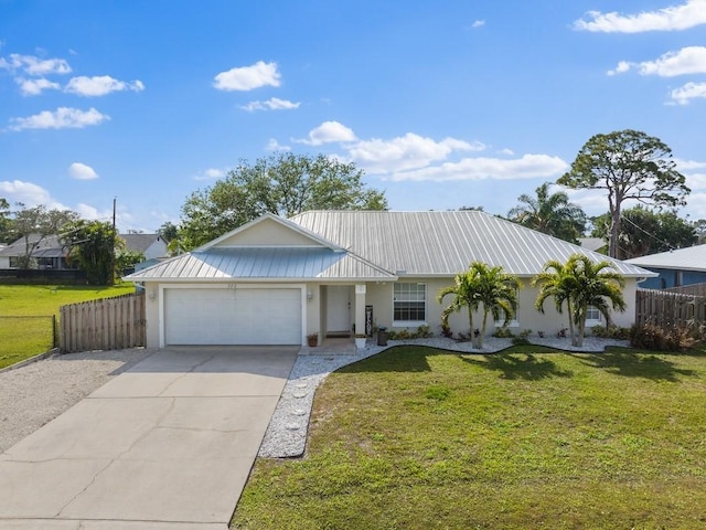 ranch-style home with a garage and a front yard