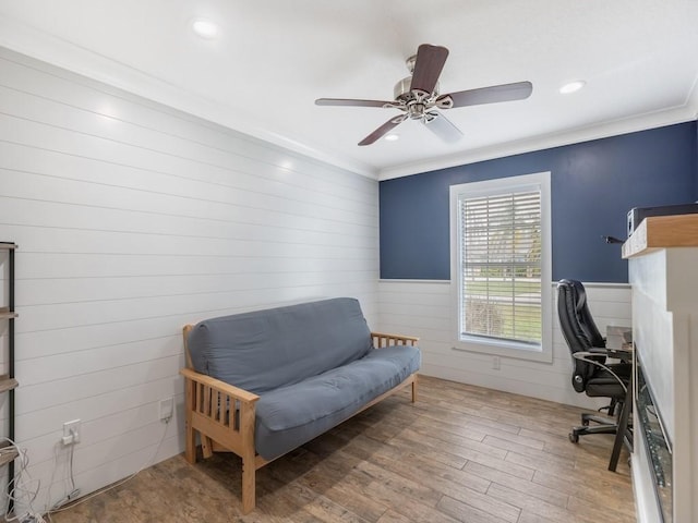 office area featuring crown molding, ceiling fan, and light hardwood / wood-style flooring