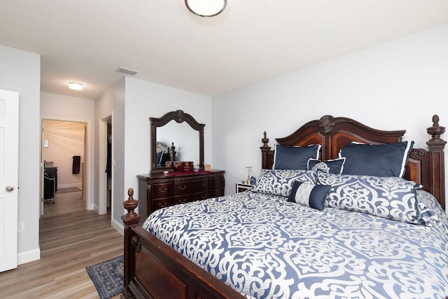 bedroom with light hardwood / wood-style flooring