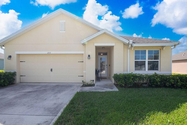 single story home with a garage and a front yard