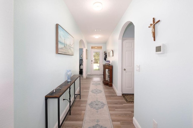 hallway featuring light wood-type flooring