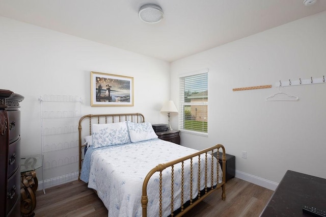 bedroom featuring dark hardwood / wood-style flooring