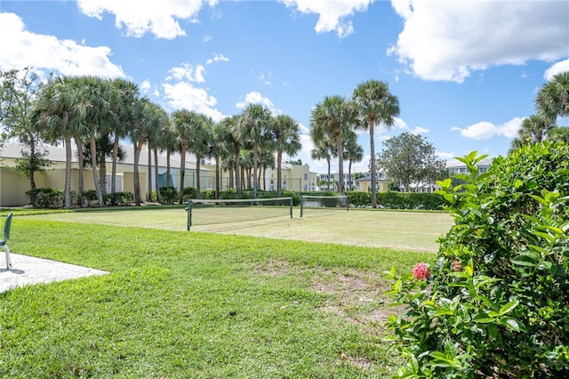 view of community featuring tennis court