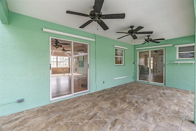 view of patio featuring ceiling fan