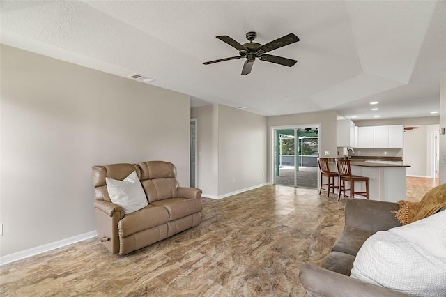 living room with ceiling fan