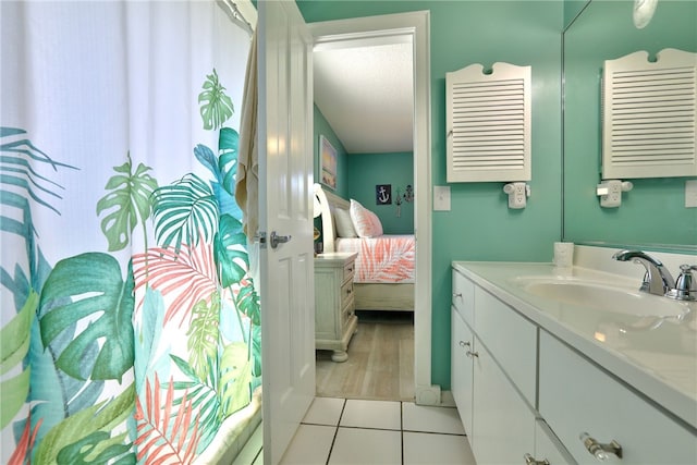 full bath with vanity, tile patterned floors, ensuite bathroom, and a shower with shower curtain